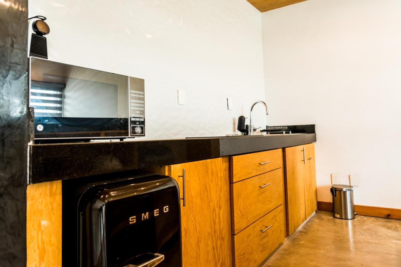Casa Ticul Hotel Boutique - 5Th Ave (Adults Only) Playa del Carmen Eksteriør billede A kitchen with a refrigerator, stove, and oven